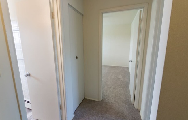 This is a photo of the linen closet in the upstairs hallway in the 1004 square foot, 2 bedroom, 1.5 bath townhome floor plan at Lake of the Woods Apartments in Cincinnati, OH.