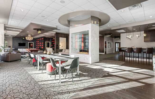A modern dining room with a circular table and chairs.