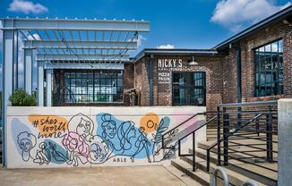 Savor wood-fired pizza at Nicky’s Coal Fired—just steps from Modera Nations in your vibrant new neighborhood.