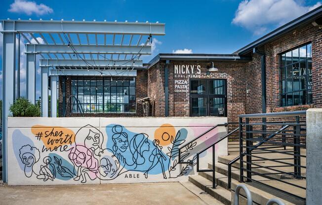 Savor wood-fired pizza at Nicky’s Coal Fired—just steps from Modera Nations in your vibrant new neighborhood.