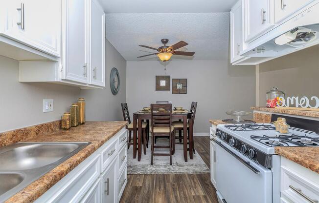 a kitchen with a stove and a sink