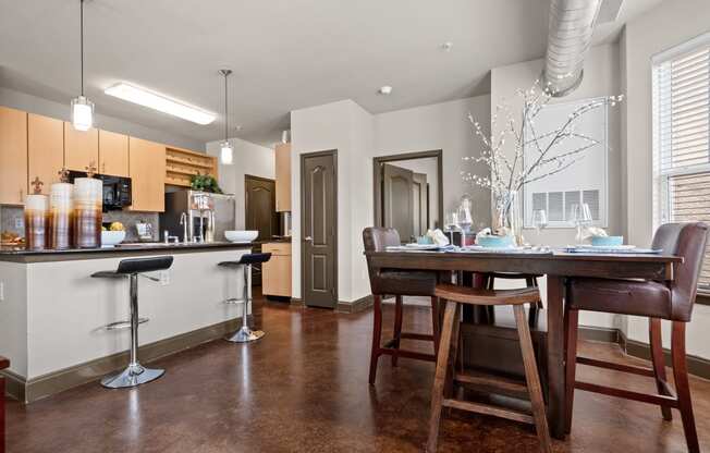 an open kitchen and dining room with a table and chairs