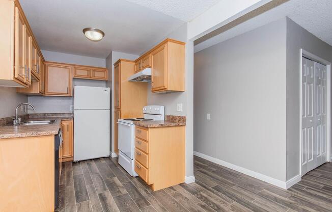 a kitchen with a stove and a refrigerator