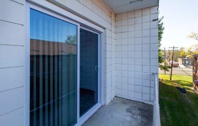 a sliding glass door on the side of a building