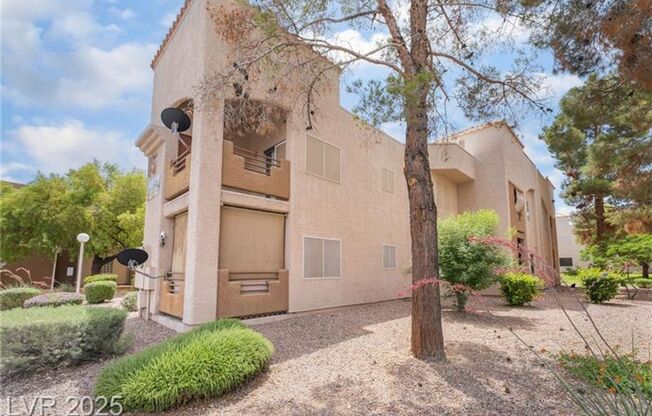 INVITING 2 BEDROOM TOP FLOOR CONDO IN A CENTRAL LOCATION NEAR UNLV AND THE STRIP