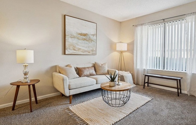 a living room with a couch and a table