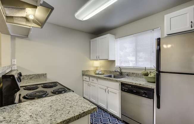 The Reserve at Bucklin Hill Apartments  kitchen with granite countertops and stainless steel appliances