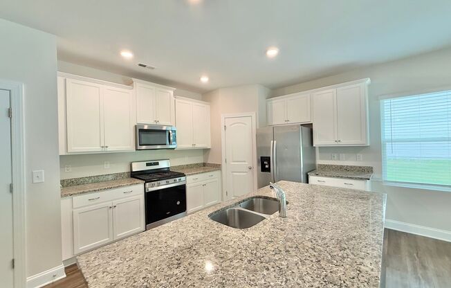 Modern 3BD, 2.5BA Raleigh Home in a Great Location with a Covered Patio and Private Backyard