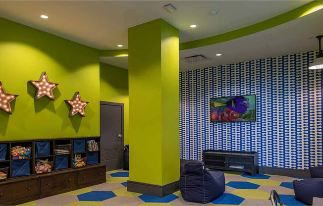 a living room filled with furniture and a flat screen tv at Shearwood Station, New Rochelle