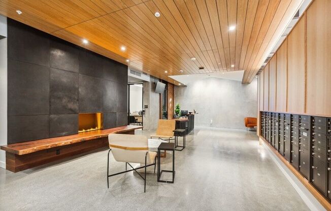 Community lobby with fireplace and mailboxes at TL Residences