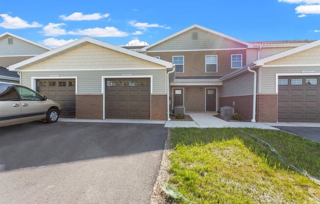 Private driveways and garages at Muskego School Apartments in Muskego, WI