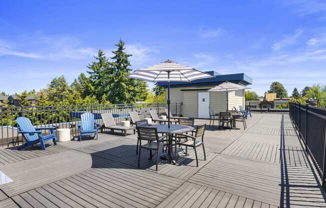 Rooftop Deck with Patio Seating at Guinevere Apartment Homes, Washington, 98103