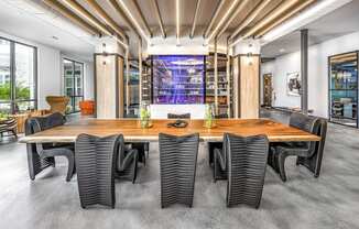 a conference room with a large wooden table and chairs at The Overlook, Winter Garden, FL