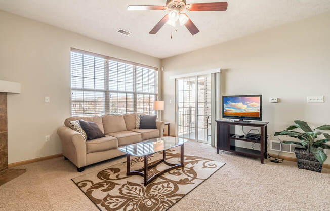 a living room with a couch and a tv