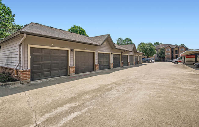 A row of garages with a clear blue sky above.