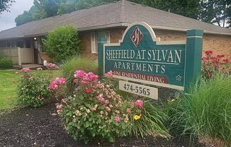 Property sign with flowers at Sheffield at Sylvan in Ohio