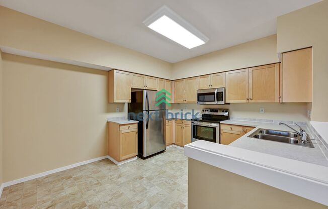 Rare Ground-Floor, End Unit with massive bonus office and Private 2-Car Garage!