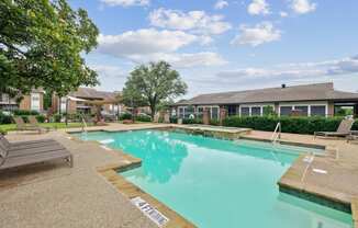 A pool with a sign that says "SAFETY FIRST" on the side.