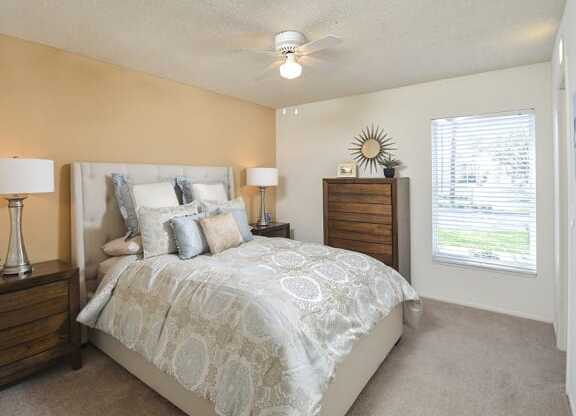 Spacious Bedroom with Plush Carpeting and Large Window