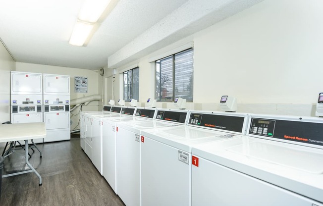 the laundry room is equipped with washers and dryers