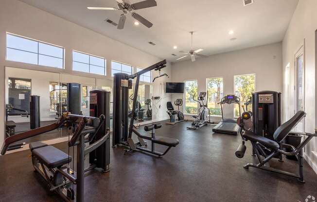 A spacious home gym with a variety of equipment.