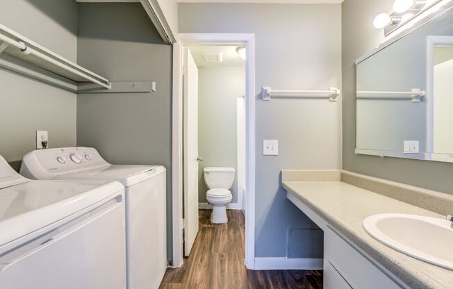 The Commons Apartments in Tampa Florida photo of a bathroom with a washer and dryer