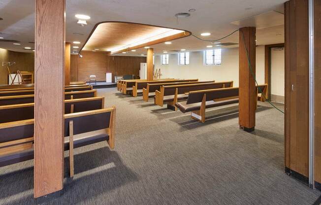a large room with many wooden pews in it at MILEPOST 5 Apartments, PORTLAND