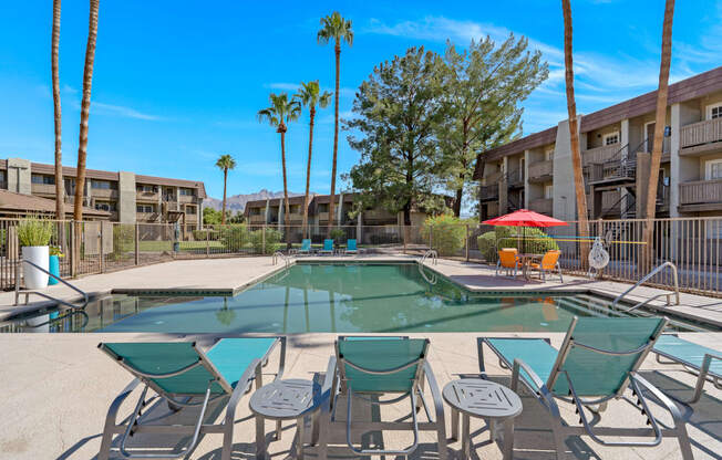 Pool with Loungers and Palm Trees at Verde Apartments, Tucson, AZ