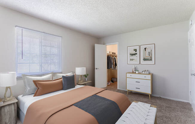 Comfortable bedroom with large windows at Hickory Lake Apartments – budget-friendly rentals in Antioch, TN perfect for every lifestyle.