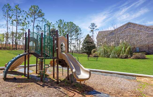 Children's playground and benches at Adrian on Riverside in Macon, GA