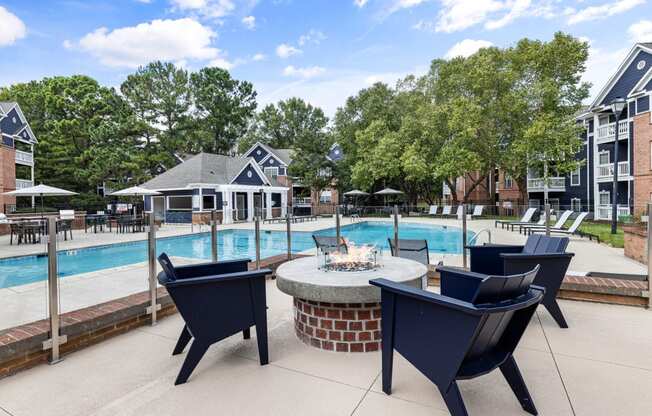 the preserve at ballantyne commons pool and patio with chairs and fire pit