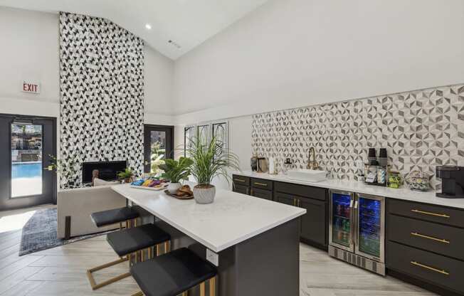 a kitchen with a marble counter top and a dining table