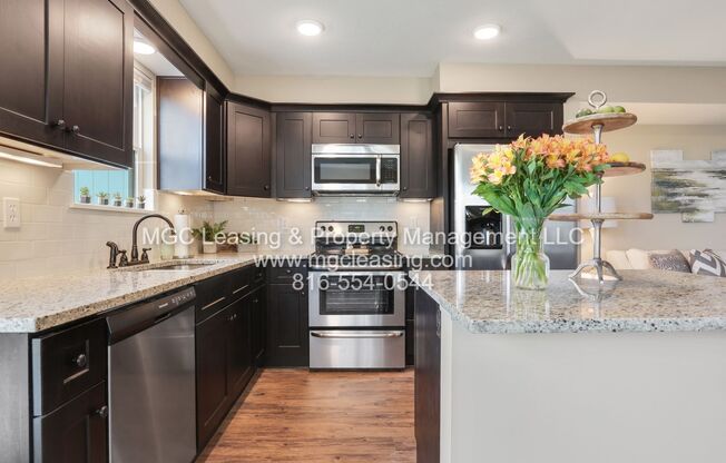 Serrano Townhomes  with walk out finished basement and full bath, minutes from Downtown KC