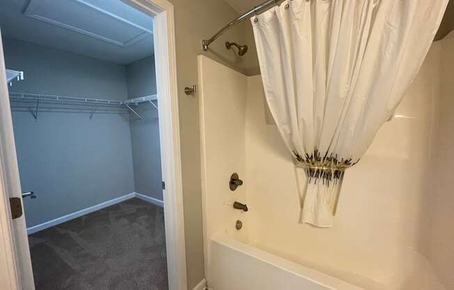 Bathroom with connecting closet at Oasis at Cedar Branch in Wilmington, NC