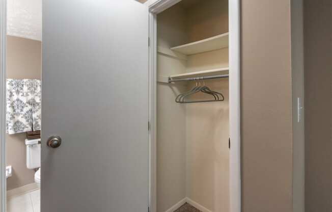 This is a photo of the living room closet in the upgraded 650 square foot, 1 bedroom, 1 bath model apartment at Deer Hill Apartments in Cincinnati, Ohio.
