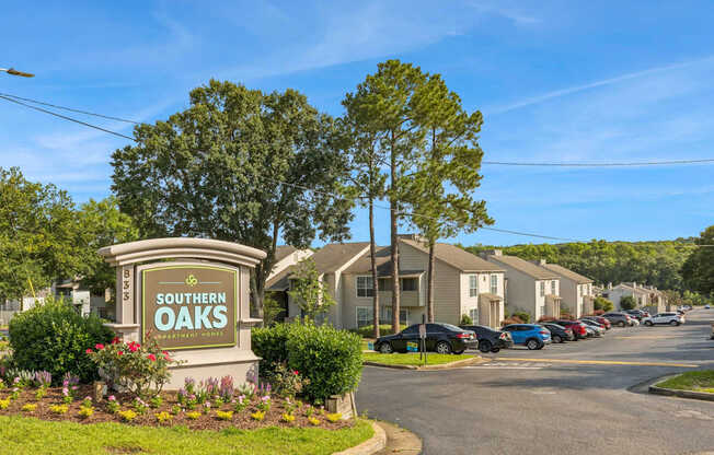 A sign for Southern Oaks is in front of a row of houses.