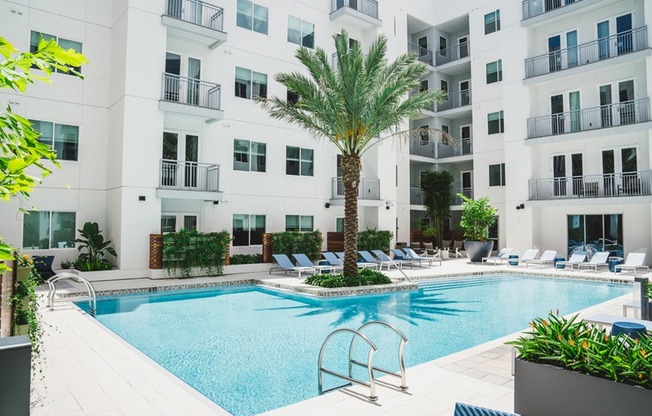 Escape to the Resort-Style Pool Courtyard with Firepit, Outdoor Games & Adjacent Social Lounge with HDTV
