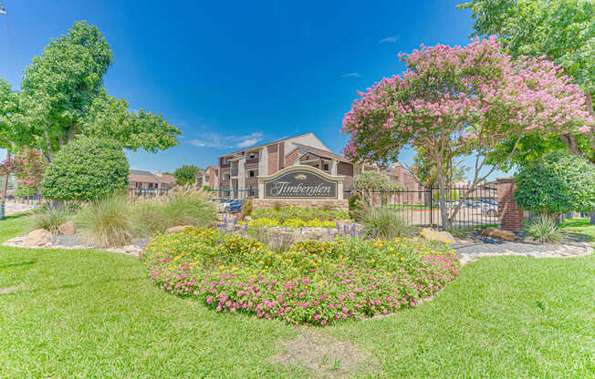 A well-maintained garden in front of a building with a sign that reads "Terrace".