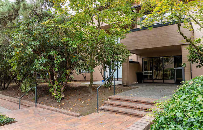 A building with a brick walkway in front of it.
