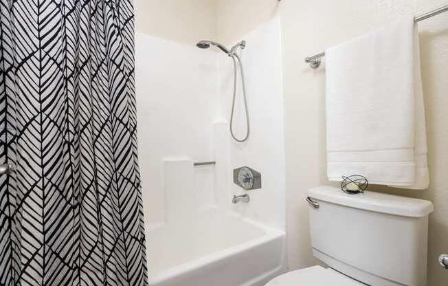 Bathroom with toilet and shower at Woodbend, Alta Loma, CA