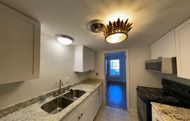 Gated Condo steps from Maple Street & St Charles!