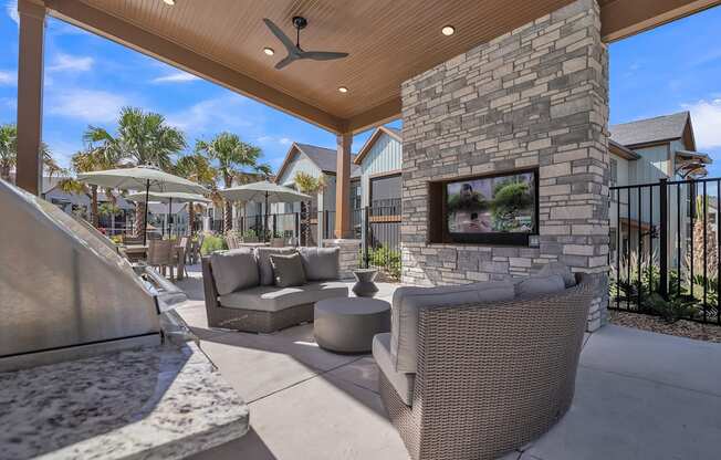 common outdoor patio with furniture and a fireplace at Canter, Ocala, FL, 34474