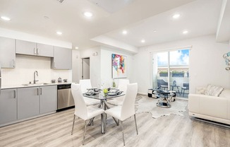 Dining area with wood inspired flooring, recessed lighting, Open kitchen, living room on the right