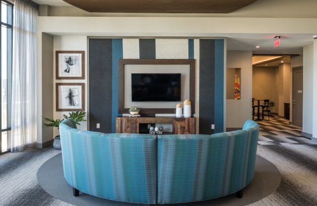 Flat Screen TV & Seating in Common Area at Tinsley on the Park | Apartments In Houston