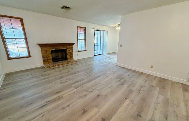 Centrally located beautiful second story condo in quiet community with vinyl plank flooring and beautiful custom showers!