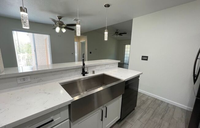 Welcome home to this recently remodeled 3 bedroom 2 bath condo with 2 car garage in a well maintained gated community.