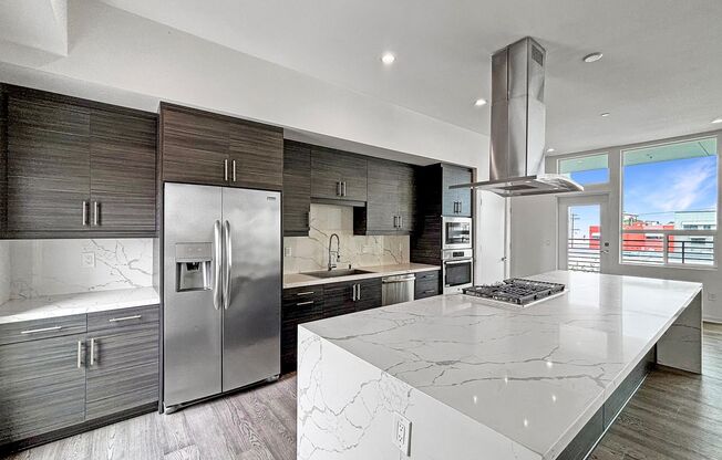 Modern 2BD/2BA Condo in North Park W/ High Ceilings, W/D & Reserved Garage Parking!