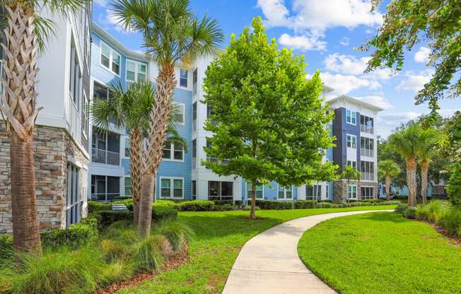 Sidewalk leading to our luxury apartment buildings at Dunedin Commons apartments in Dunedin, FL