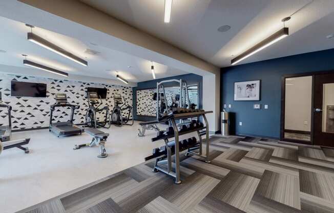 a fitness center with treadmills and other exercise equipment