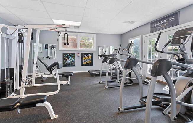 Fitness center with windows and natural light at Barracks West in Charlottesville, VA